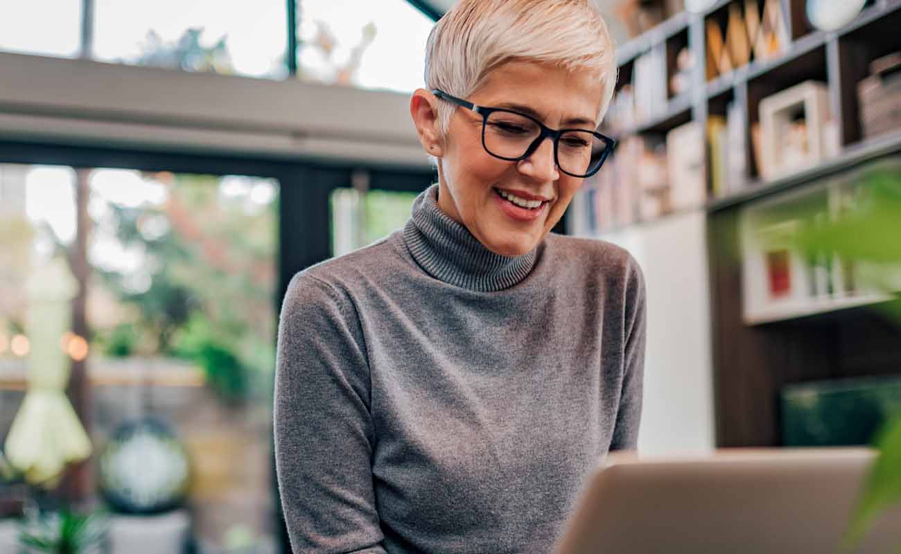 A woman working on her laptop. A woman working on her laptop.