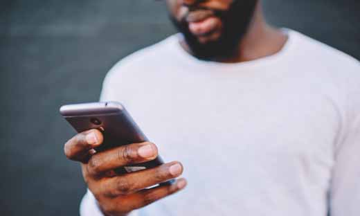 A man checks his phone.